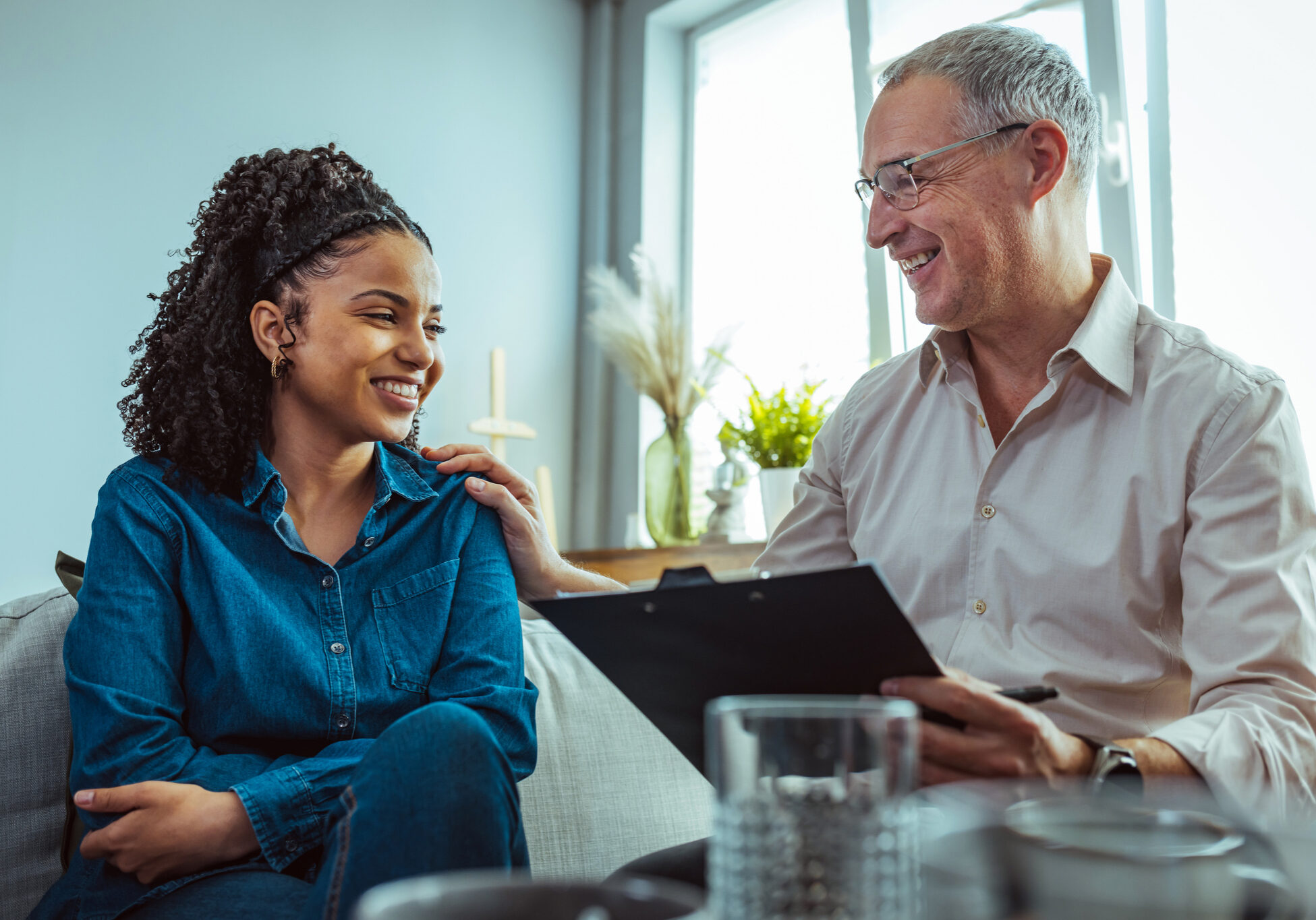 Therapist and patient smiling during counseling session